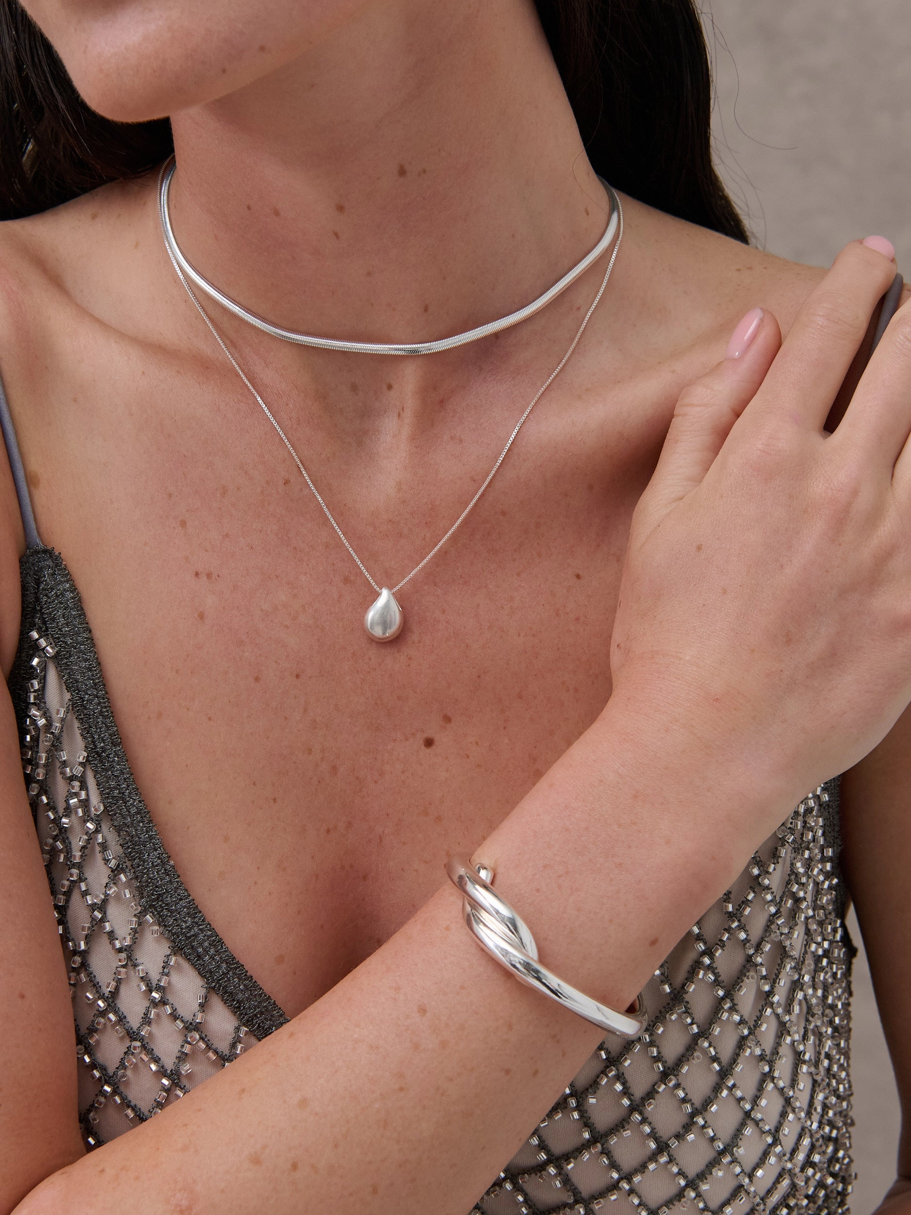 Interlock Twist Sterling Silver Plated Bangle