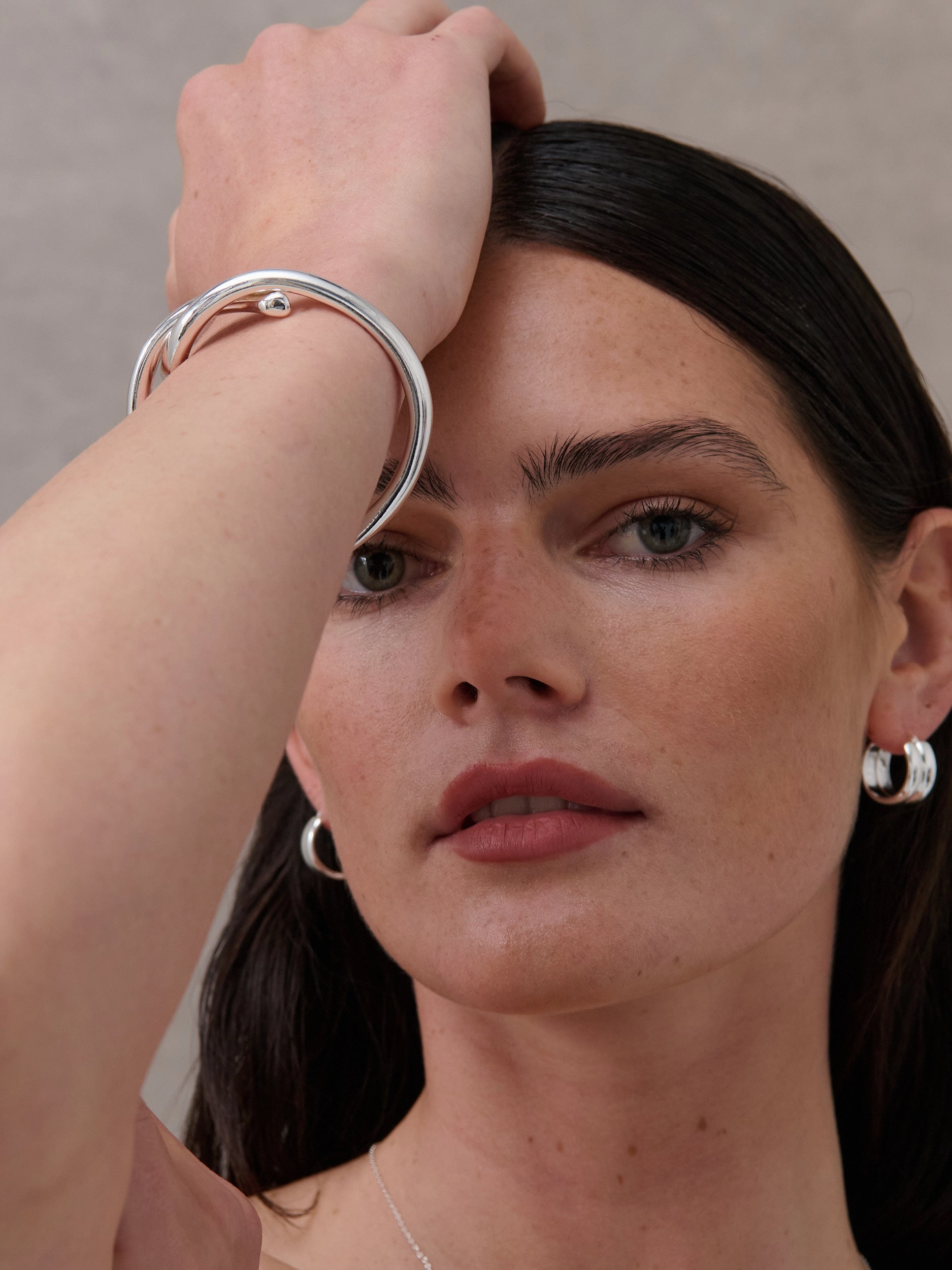 Interlock Twist Sterling Silver Plated Bangle