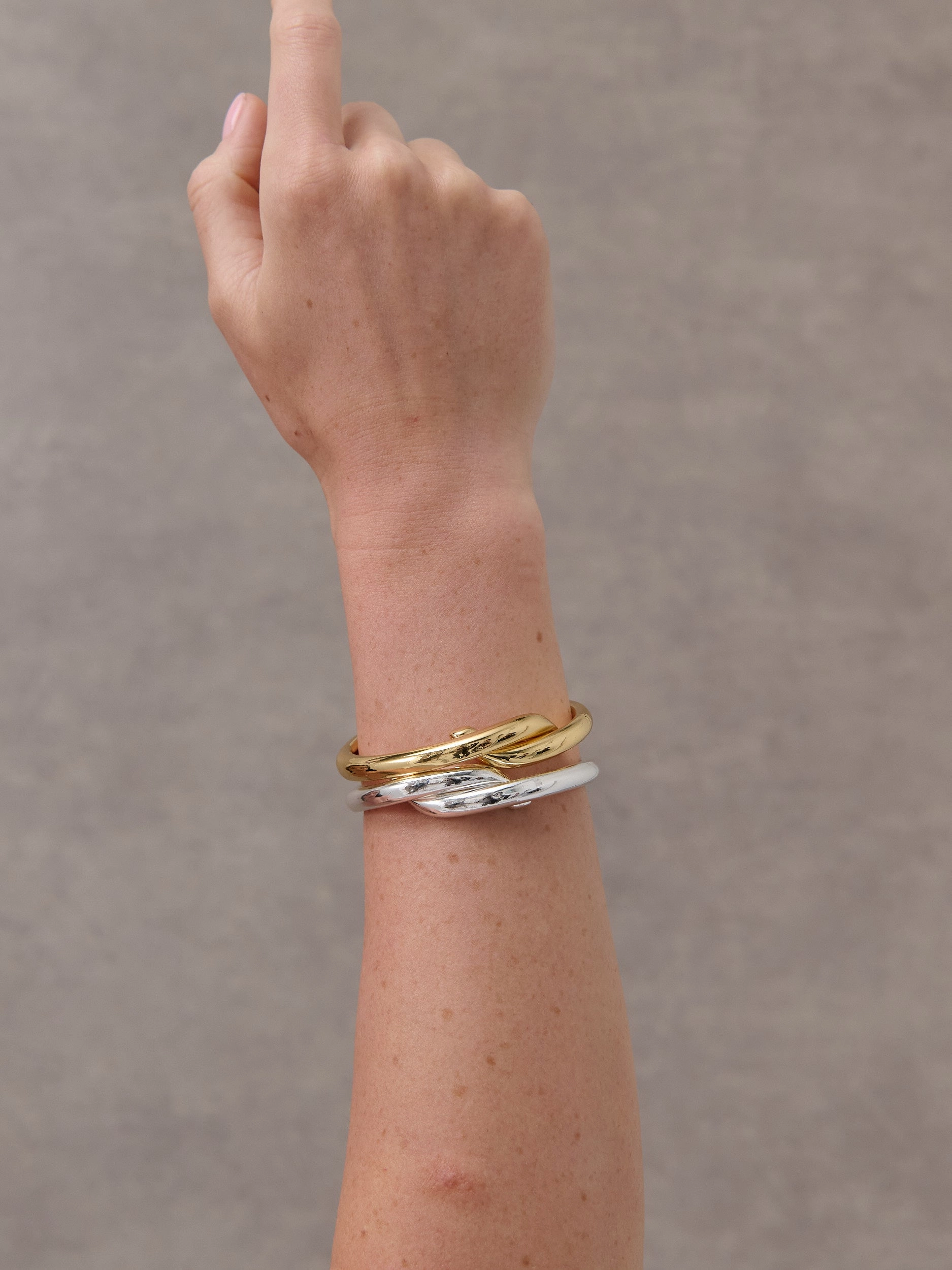 Interlock Twist Sterling Silver Plated Bangle
